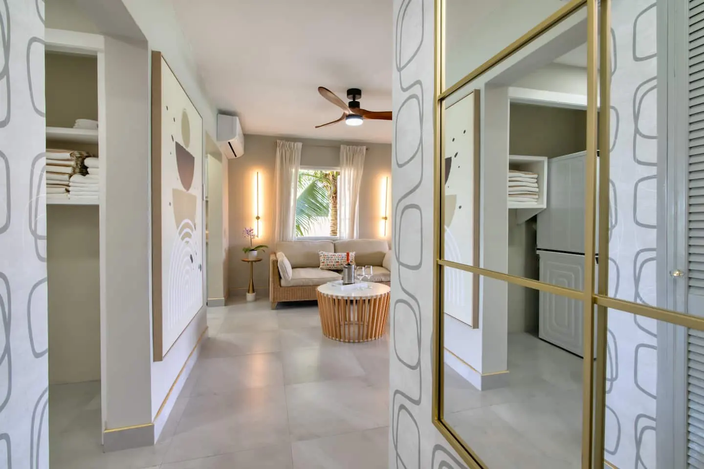 Entrance hallway leading to the living area, with laundry storage alongside.