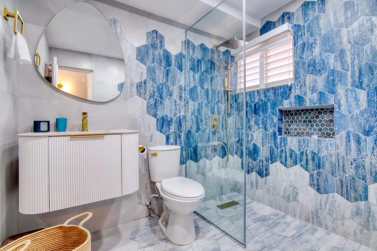 Bathroom 2: glass shower enclosure with blue hexagonal tiles.