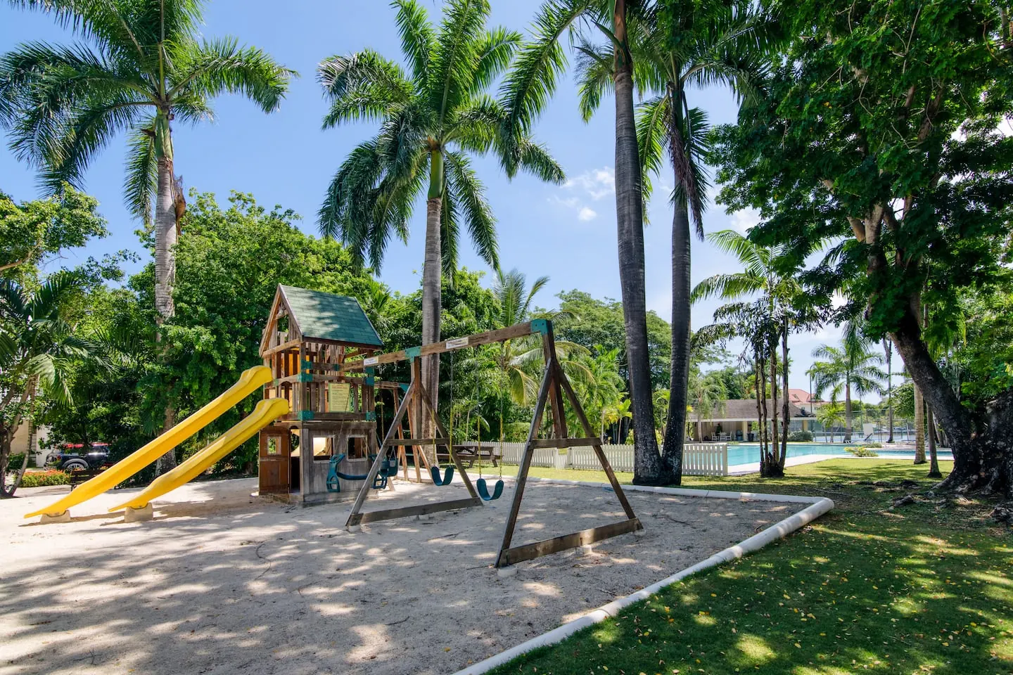 Shared community playground with slides and swings.